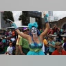 Andrea McGuffee dances during Lundi Gras celebration during Mardi Gras in New Orleans.