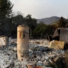A water heater stands on top of remains of a home destroyed by the Nuns Fire along Napa Road in Sonoma, California October 9, 2017