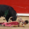 Peruvian bullfighter Andres Roca Rey is gored by a bull during a bullfight at the San Fermin festival in Pamplona.