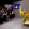 A dancer performs for photographers during a Sony news conference at the 2017 CES in Las Vegas, Nevada.