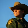 U.S. border patrol agent Katherine Griffith looks out from atop her horse while out on patrol along the U.S.-Mexico border near San Diego, California.