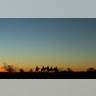 U.S. Border Patrol agents from Boulevard Station look out over a ridge after sunset near Jacumba, California.