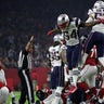 New England Patriots' Dont'a Hightower (L) and Kyle Van Noy celebrate after New England recovered the ball during the fourth quarter against the Atlanta Falcons at Super Bowl LI in Houston, Texas.