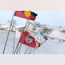 Tribal flags catch the wind in the opposition camp. 