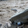 A bus is seen after a landslide and flood in Chosica, east of Lima, Peru 