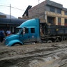 A truck is seen at the Central highway after a landslide and flood in Chosica, east of Lima.