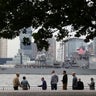 A vessel arrives in New York Harbor to mark the beginning of Fleet Week in New York