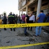 Police tape cordon is seen at the site of a car bomb attack in Baghdad