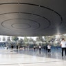 People await the start of a product launch event at Apple's new campus in Cupertino, California, Tuesday
