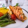 Lobster thermidor with buttered asparagus, slow-roasted vine-ripened tomato, saffron rice