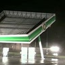 Part of a gas station blows over in the winds of Hurricane Florence in Topsail Beach, North Carolina, Friday