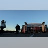 People pose for photos in front of NRG Stadium in Houston, Texas.