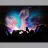 Football fans snap photos of the 3D light show on water spray at Super Bowl Live in Discovery Green park.