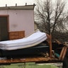 Tornadoes touched down in the upper Midwest and northern Arkansas, killing at least three people.
