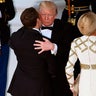 The Trumps and Macrons greeted each other with European-style air kisses prior to Tuesday's state dinner. 