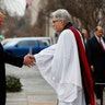 Rev Luis Leon greets President-elect Donald Trump and his wife Melania as they arrive for a church service at St. John’s Episcopal Church across from the White House in Washington, Friday, Jan. 20, 2017, on Donald Trump's inauguration day. (AP Photo/Alex Brandon)