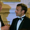 President Trump speaks to French President Emmanuel Macron after the pair exchanged toasts during Tuesday's state dinner.  