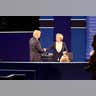 Donald Trump and Hillary Clinton shake hands after a testy debate.