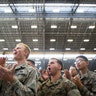 U.S. service members greet President Trump and first lady Melania Trump during a visit to Hawaii.