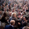 President Donald Trump greets U.S. service members after speaking at a hangar rally at Yokota Air Base