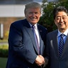 President Trump, shakes hands with Japanese Prime Minister Shinzo Abe at Kasumigaseki Country Club.