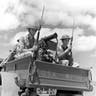 Unpublished, young defenders beside a mounted machine gun, Hawaii, Dec. 1941