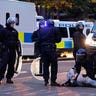 UK_riot_arrest_AP