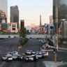 A roadblock is shown through a gap in a glass partition at the corner of Las Vegas Boulevard and Tropicana Avenue