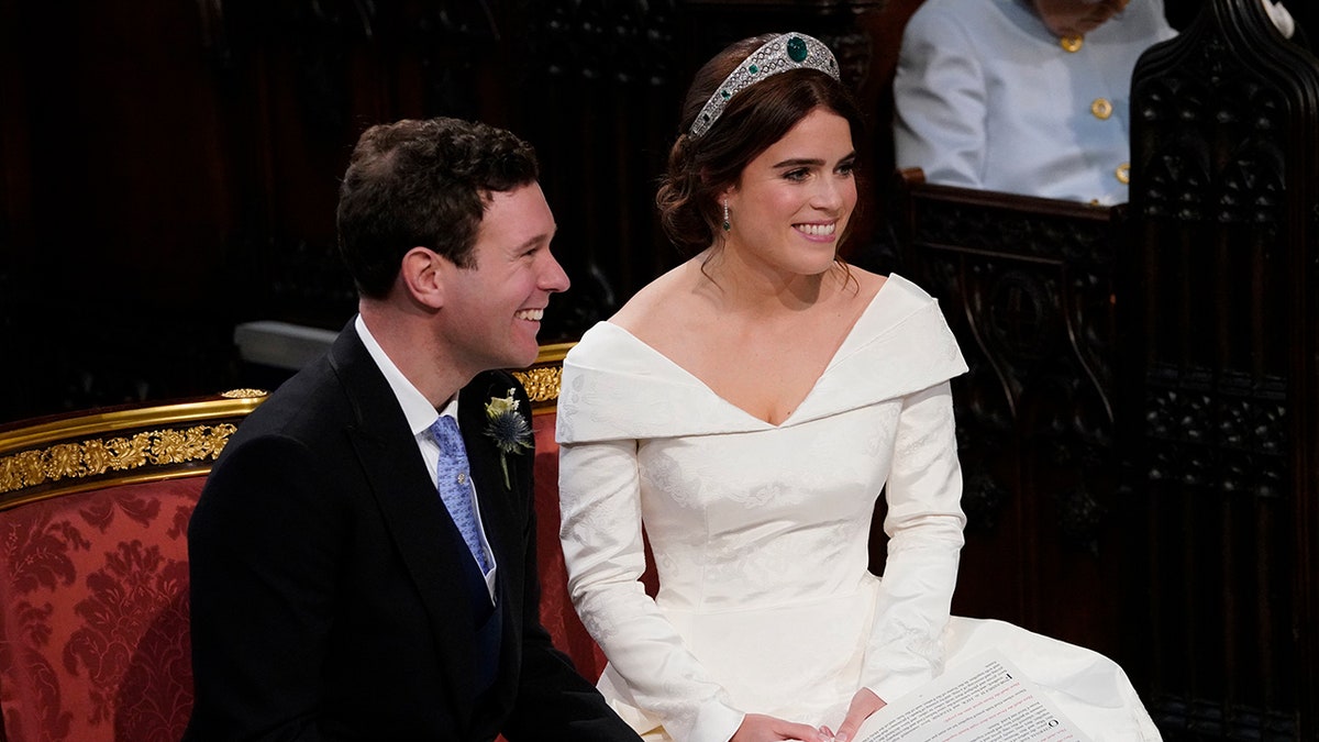 Britain's Princess Eugenie and Jack Brooksbank during their wedding ceremony in St George’s Chapel, Windsor Castle, near London, England, Friday Oct. 12, 2018. (Danny Lawson/Pool via AP)