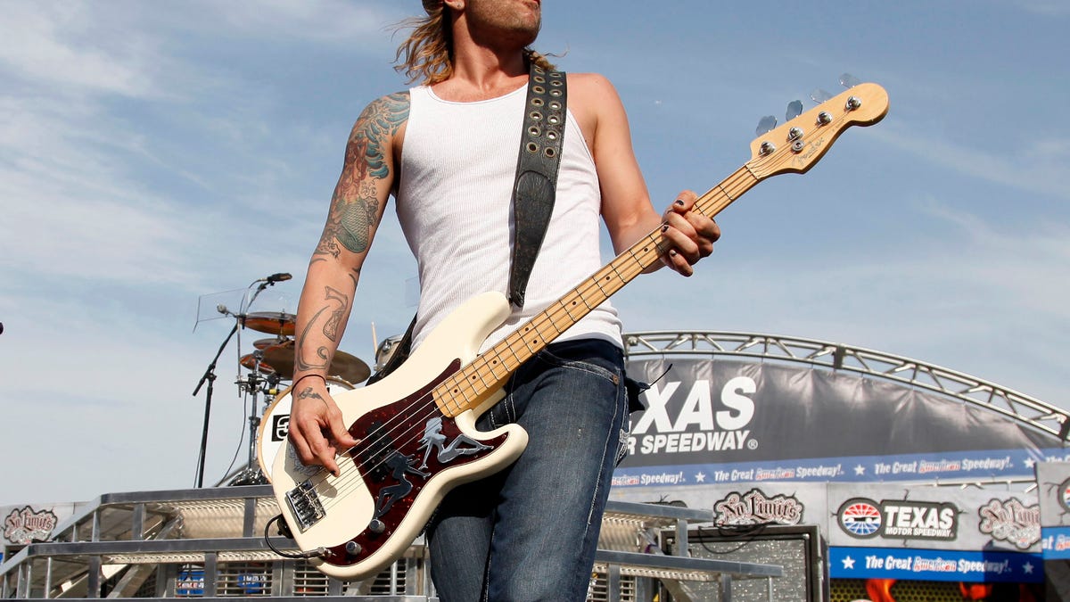 FILE - In this April 9, 2011 file photo, 3 Doors Down' bassist Todd Harrell performs before a NASCAR auto race at Texas Motor Speedway in Fort Worth, Texas. Harrell, the founding member and former bassist of the rock band 3 Doors Down has been sentenced to 10 years in Mississippi state prison for possession of a firearm by a felon. News outlets report Jackson County Circuit Court Judge Robert Krebs gave Todd Harrell the maximum penalty during a hearing Thursday, Oct. 11, 2018.