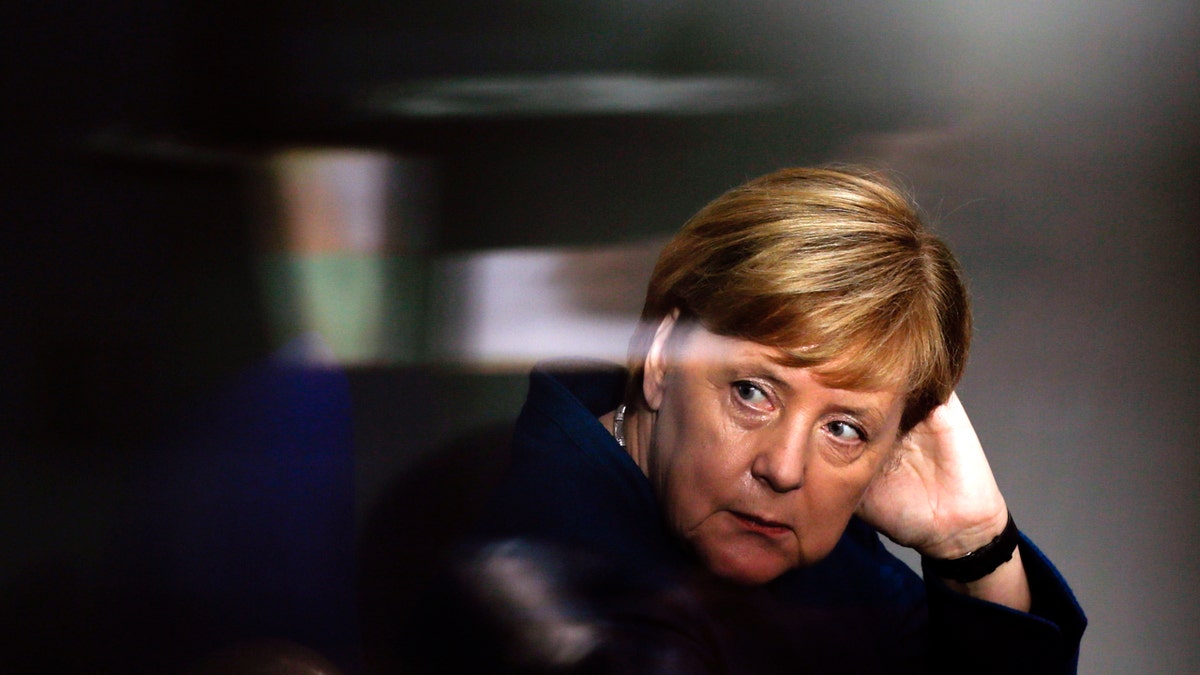 FILE - In this Oct. 17, 2018 file photo German Chancellor Angela Merkel attends a meeting of the German federal parliament, Bundestag, at the Reichstag building in Berlin. The stakes are unusually high for German Chancellor Angela Merkel’s government as the central region of Hesse votes in a state election this weekend. (AP Photo/Markus Schreiber, file)