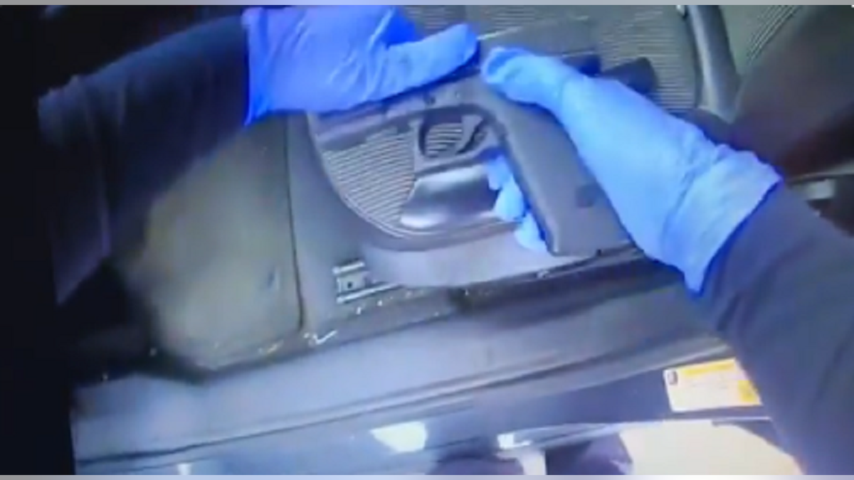 Police said they found a stolen gun beneath Madison's infant daughter.