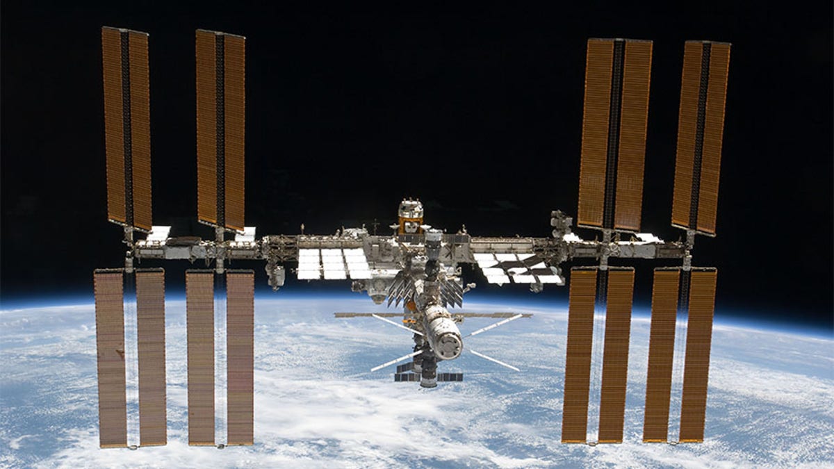 The International Space Station is featured in this image photographed by an STS-133 crew member on space shuttle Discovery after the station and shuttle began their post-undocking relative separation