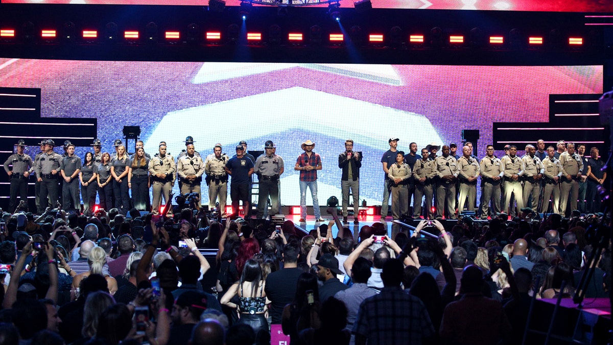 Bobby Bones, center right, and Jason Aldean, center left, appear onstage at the 2018 iHeartRadio Music Festival Day 1 held at T-Mobile Arena on Friday, Sept. 21, 2018, in Las Vegas.