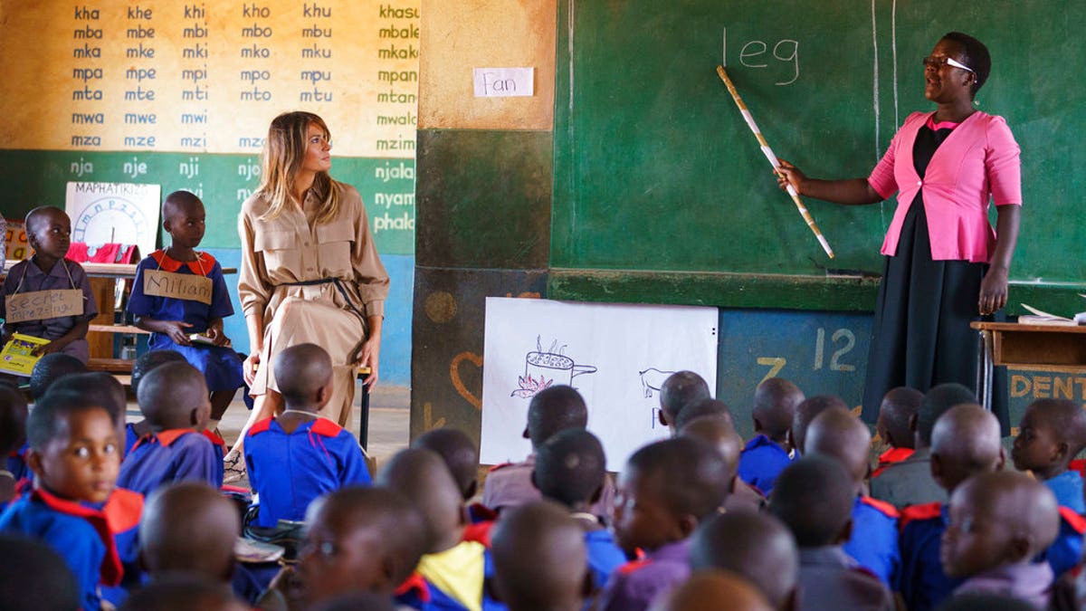 First lady Melania Trump sits with a student during language class as she visits Chipala Primary School, in Lilongwe, Malawi. (AP Photo/Carolyn Kaster)