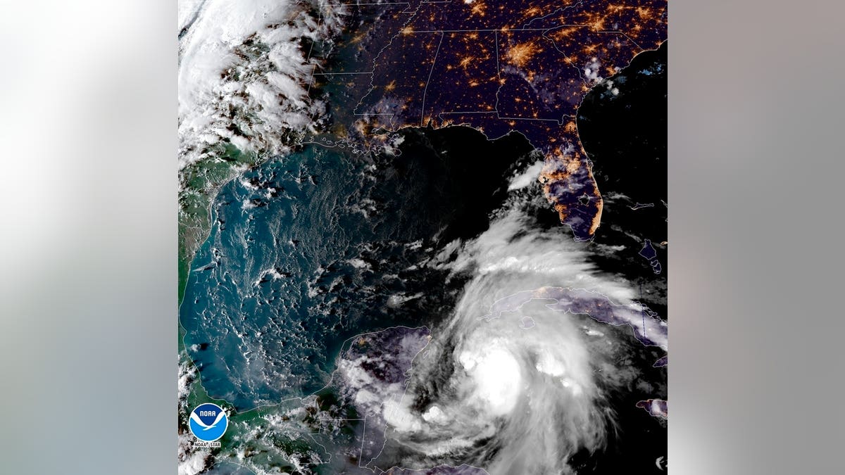 A satellite image shows a view of Tropical Storm Michael, churning as it heads toward the Florida Panhandle.