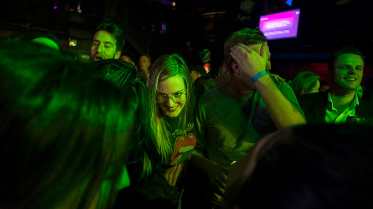 People celebrate at Leafly's countdown party as midnight passes and marks the first day of the legalization of cannabis across Canada in Toronto on Wednesday