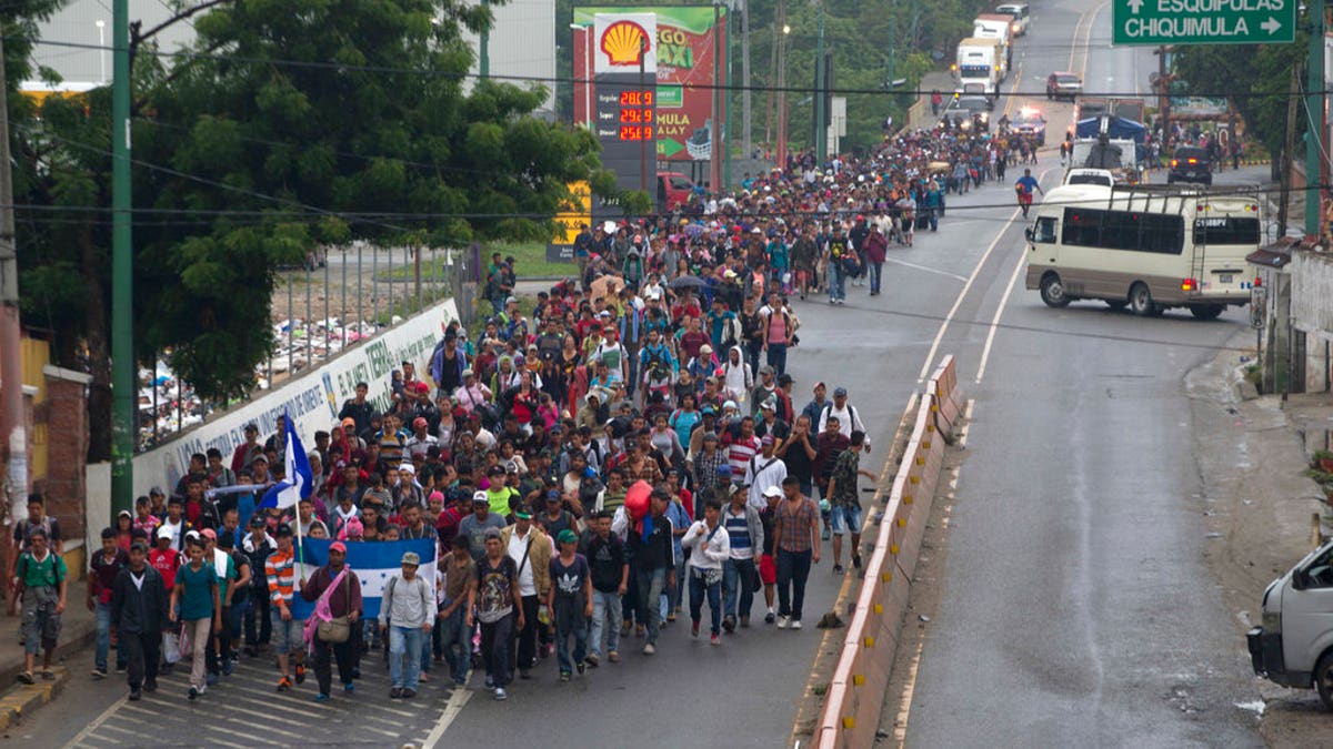 FILE: Honduran migrants walking to the U.S. start their day departing Chiquimula, Guatemala.