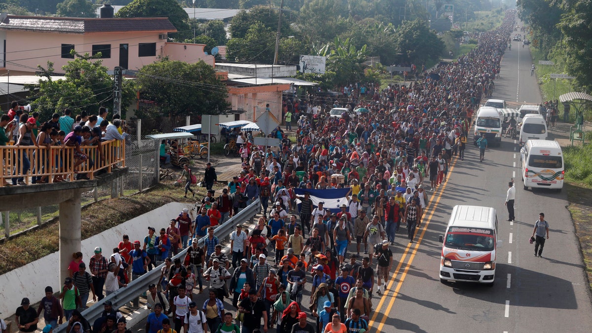 Central American migrants walking to the U.S. start their day departing Ciudad Hidalgo, Mexico, Sunday, Oct. 21, 2018. Despite Mexican efforts to stop them at the border, about 5,000 Central American migrants resumed their advance toward the U.S. border early Sunday in southern Mexico.
