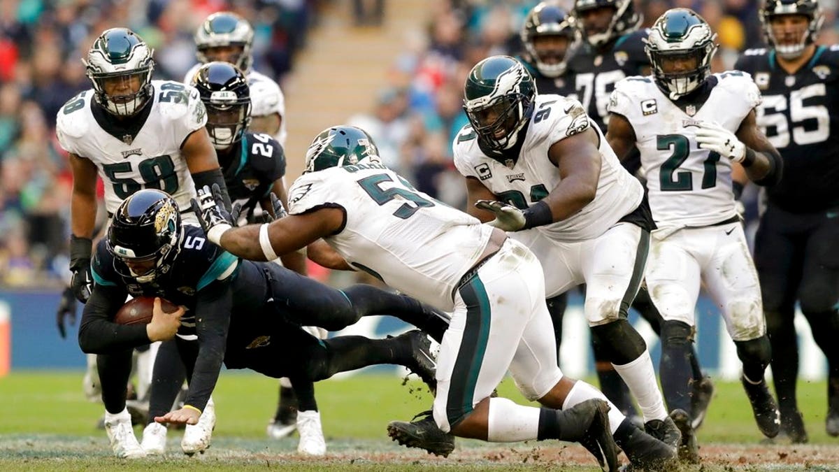 FILE: Jacksonville Jaguars quarterback Blake Bortles dives to make a down during the second half of an NFL football game against Philadelphia Eagles at Wembley stadium in London.