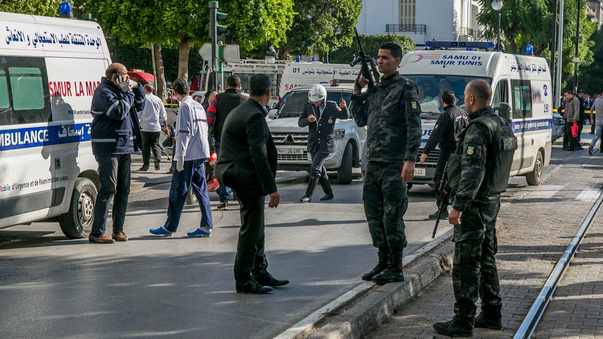 Tunisian police officers secure the site of an attack after a 30-year-old woman blew herself on the Habib Bourguiba avenue in Tunis, Tunisia. (AP Photo/Riadh Dridi)