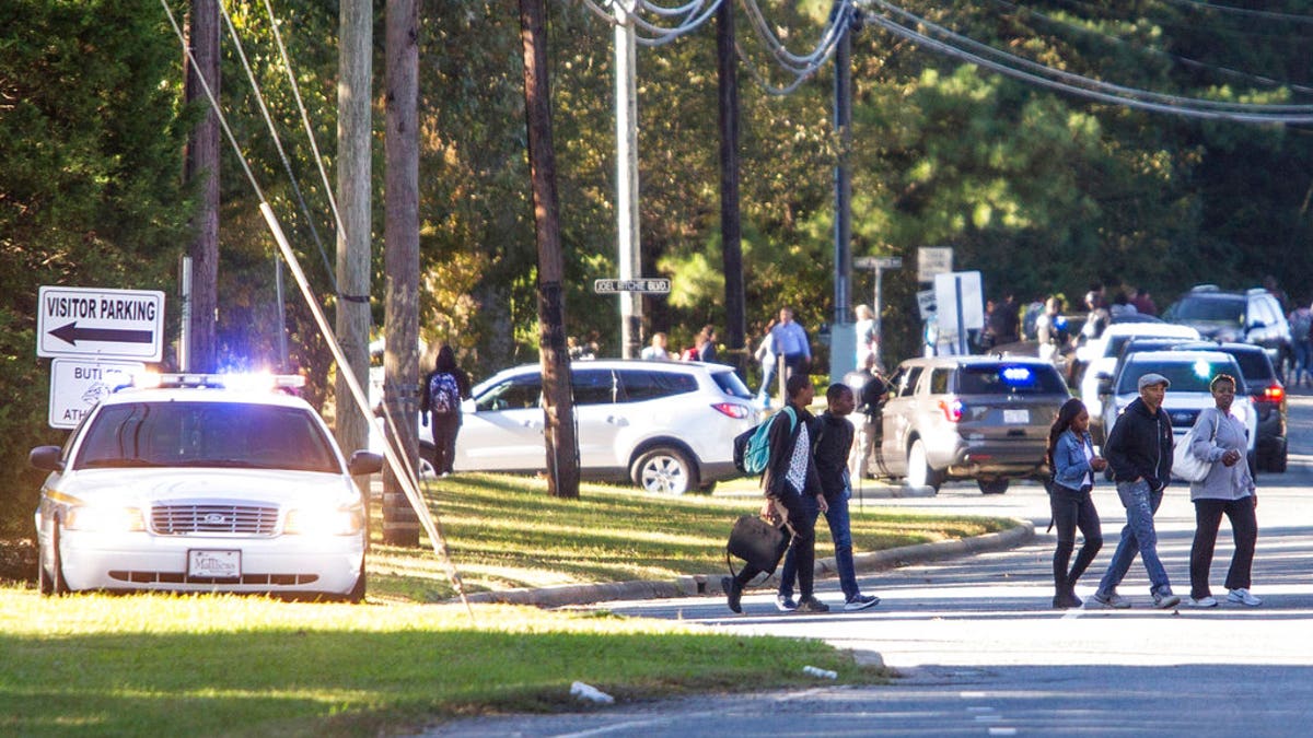 A student shot and killed a fellow classmate during a fight in a crowded school hallway Monday, officials said, prompting a lockdown and generating an atmosphere of chaos and fear as dozens of parents rushed to the school to make sure their children were safe.