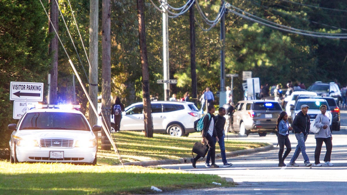 A student shot and killed a fellow classmate during a fight in a crowded school hallway Monday, officials said, prompting a lockdown and generating an atmosphere of chaos and fear as dozens of parents rushed to the school to make sure their children were safe.