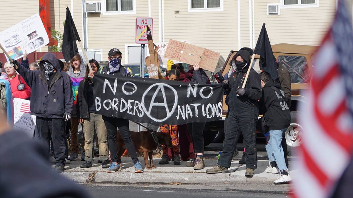 A group of 20 or so protesters gathered Sunday on the opposite sidewalk of the "American flag appreciation walk" in New Paltz, New York.