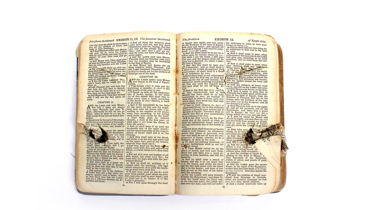 The Bible was damaged when a German plane machine-gunned a makeshift hospital.