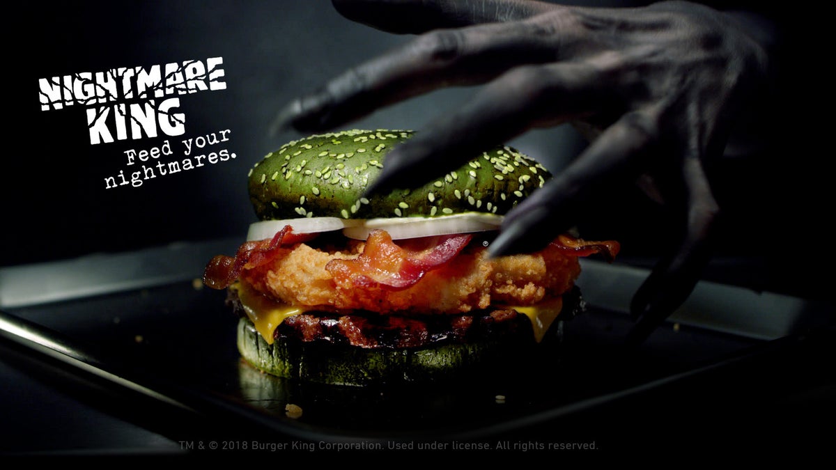 Burger King is releasing a green burger stuffed with chicken, beef and bacon just in time for Halloween.