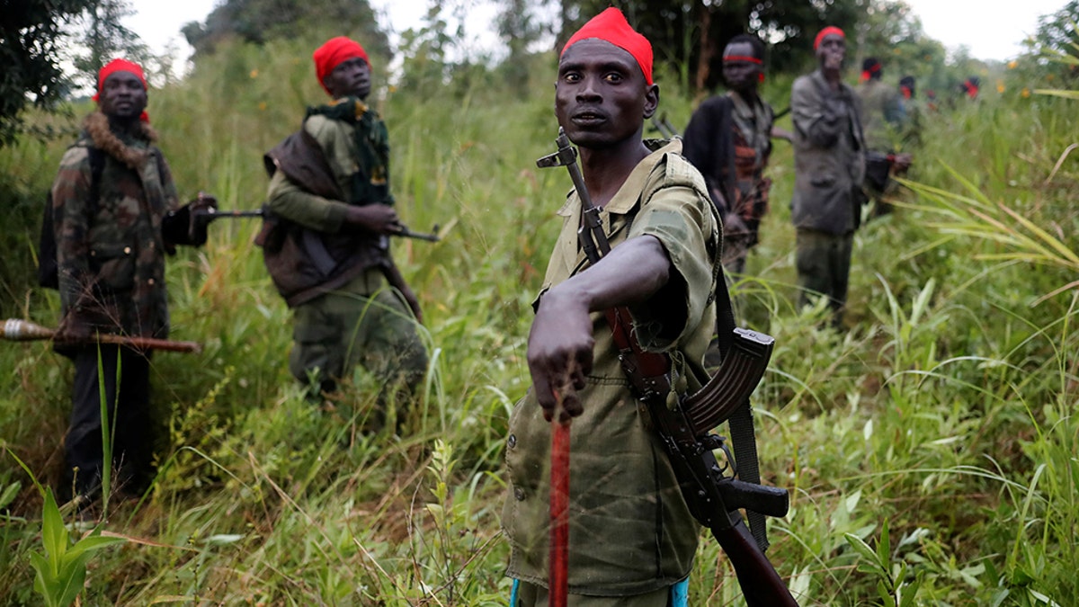 SPLA-IO (SPLA-In Opposition) rebels stand after an assault on government SPLA (Sudan People's Liberation Army) soldiers, outside the town of Kaya, on the border with Uganda, South Sudan, August 26, 2017. REUTERS/Goran Tomasevic 