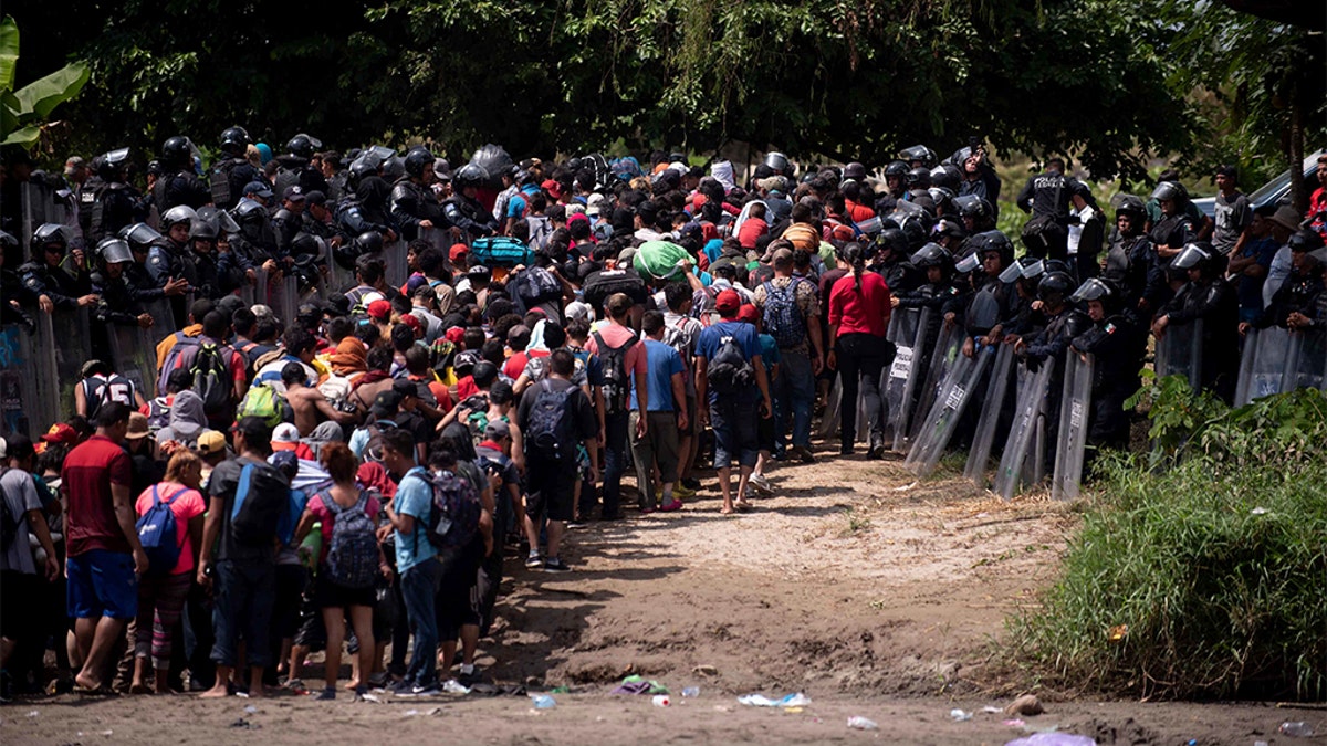 The group of Central American migrants were met by Mexican Federal Police. (AP Photo/Santiago Billy)