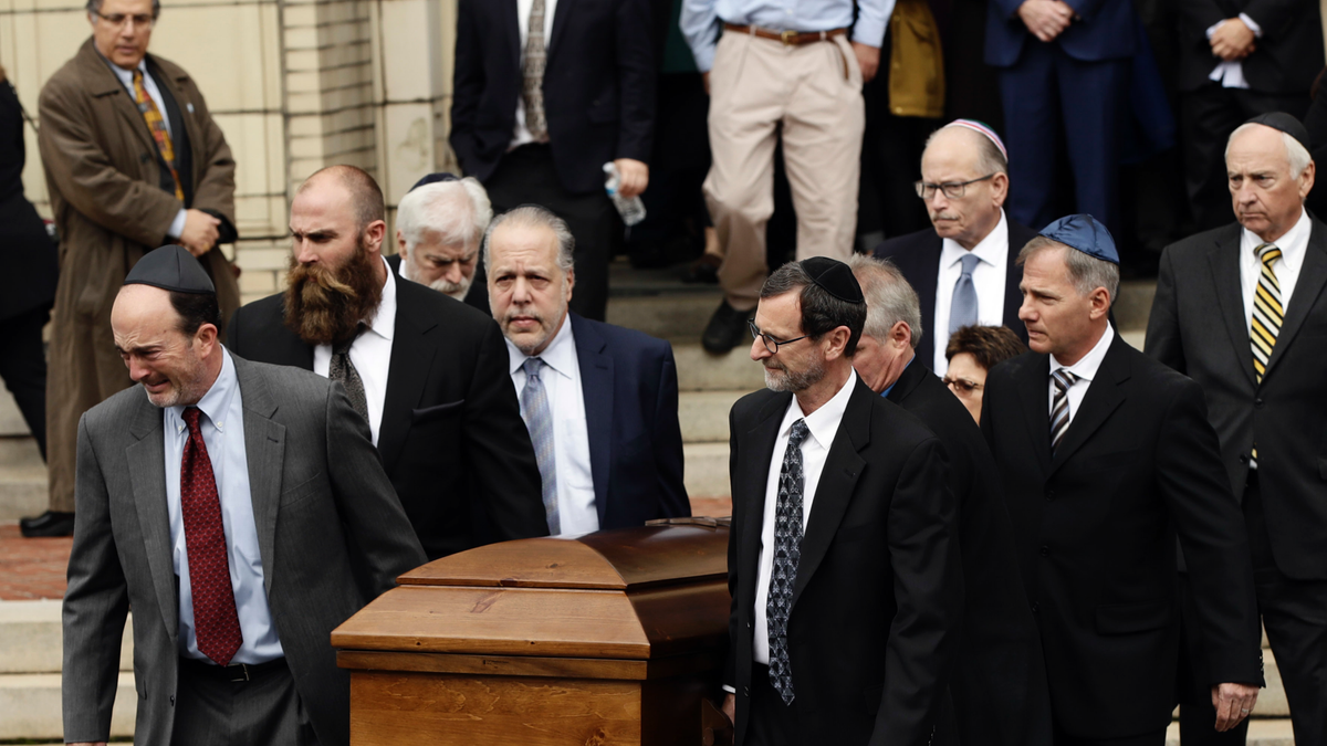 A casket is carried out of Rodef Shalom Congregation after the funeral services for brothers Cecil and David Rosenthal, Tuesday, Oct. 30, in Pittsburgh. The brothers were killed in the mass shooting last week.