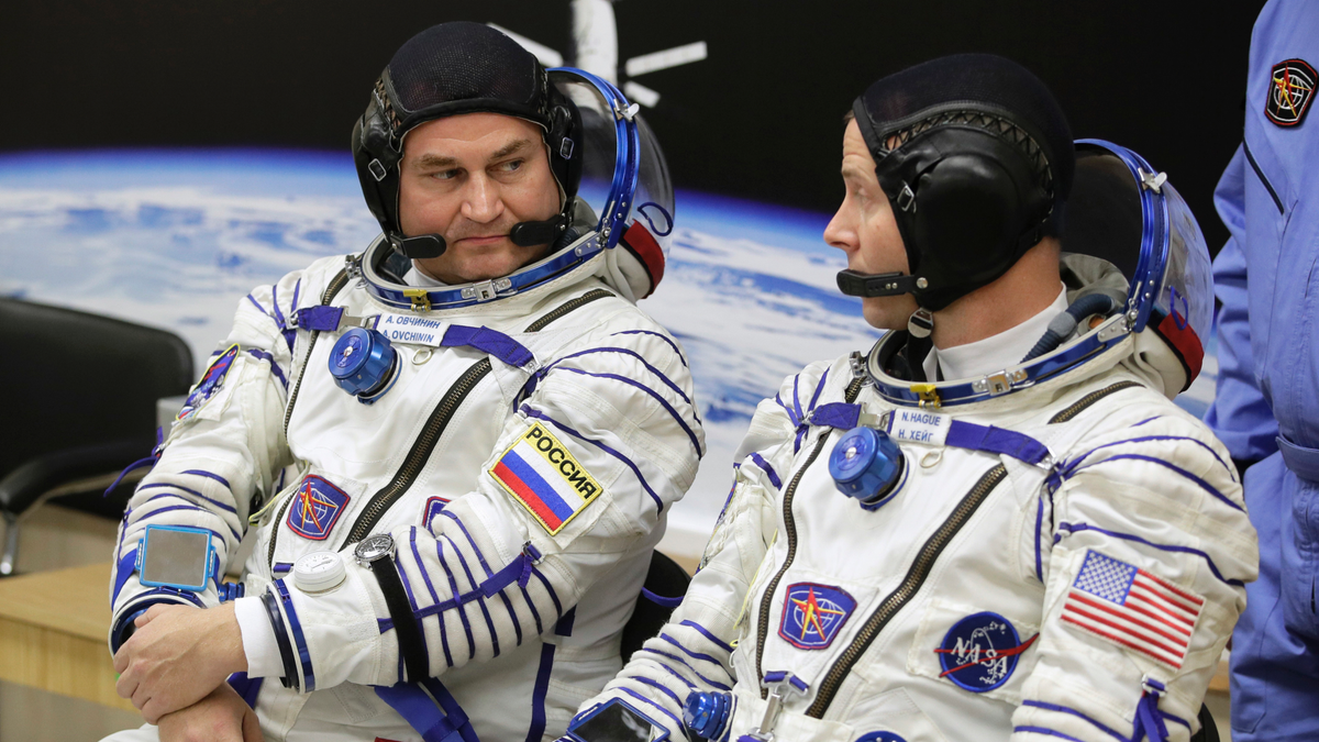 U.S. astronaut Nick Hague, right and Russian cosmonaut Alexey Ovchinin, member of the main crew of the expedition to the International Space Station (ISS), speak prior to the launch of Soyuz MS-10 space ship at the Russian leased Baikonur cosmodrome, Kazakhstan, Thursday, Oct. 11, 2018. (AP Photo/Dmitri Lovetsky)
